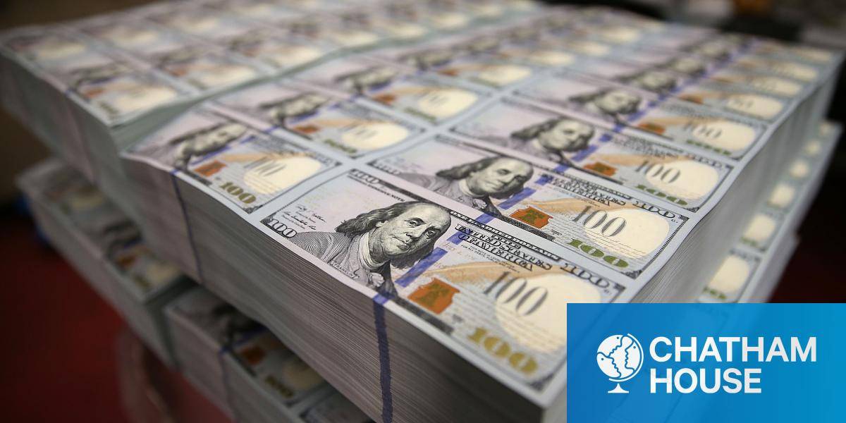 Newly $100 notes lay in stacks at the Bureau of Engraving and Printing on 20 May 2013 in Washington, DC. 