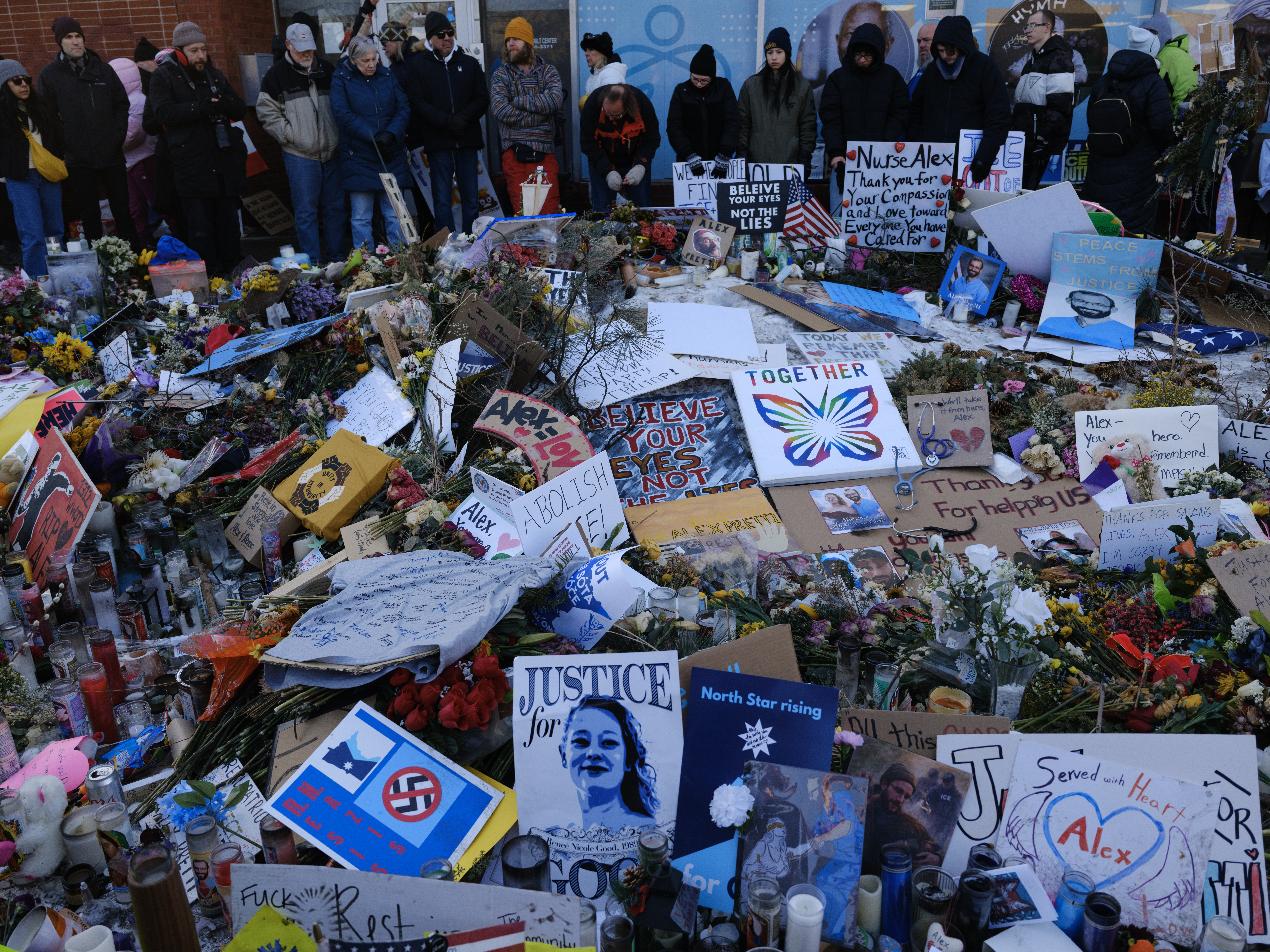 MINNEAPOLIS, MINNESOTA - JANUARY 31: People continue to come visit and grieve at the growing street memorial site where Alex Pretti was shot and killed by two Federal agents, January 31, 2026, on Nicollet Avenue in Minneapolis, Minnesota. As part of President Trump's plan to deport immigrants, over 3,000 Immigration Customs Enforcement (ICE) agents were sent to Minneapolis, against the wishes of most of the community, the mayor, and the governor. (Photo by Andrew Lichtenstein/Corbis via Getty Images)