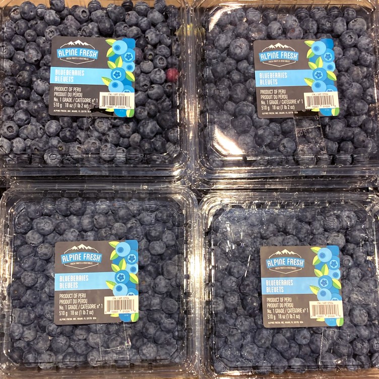 A grid of six blueberry packages with different labels.