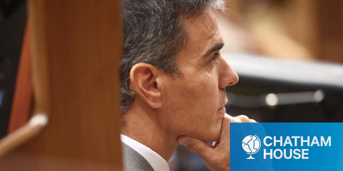 Spanish Prime Minister Prime Minister Pedro Sanchez listens to proceedings in Spain's parliament.