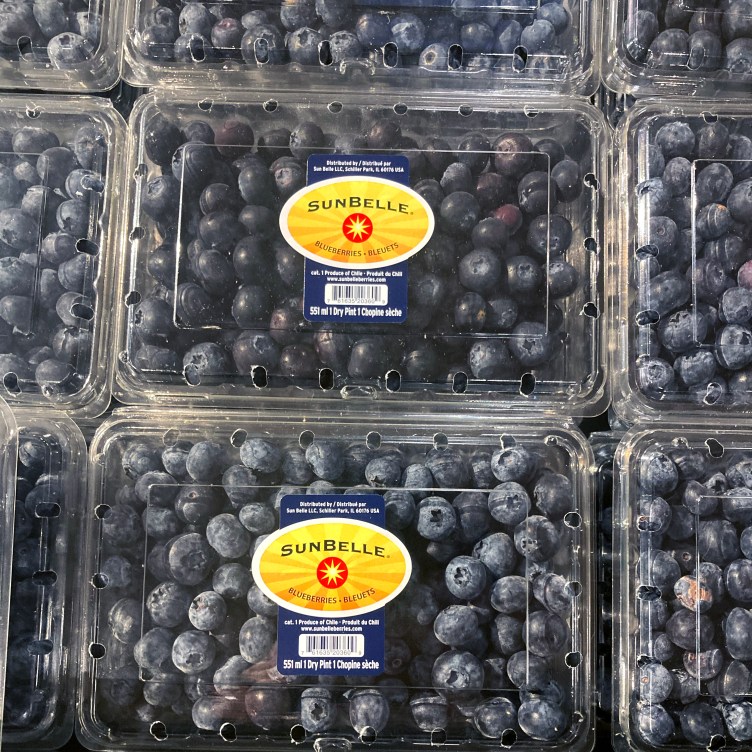 A grid of six blueberry packages with different labels.