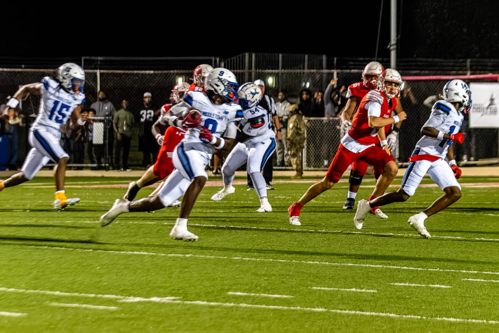 Junior Tysir Young takes off toward the endzone after intercepting the ball.