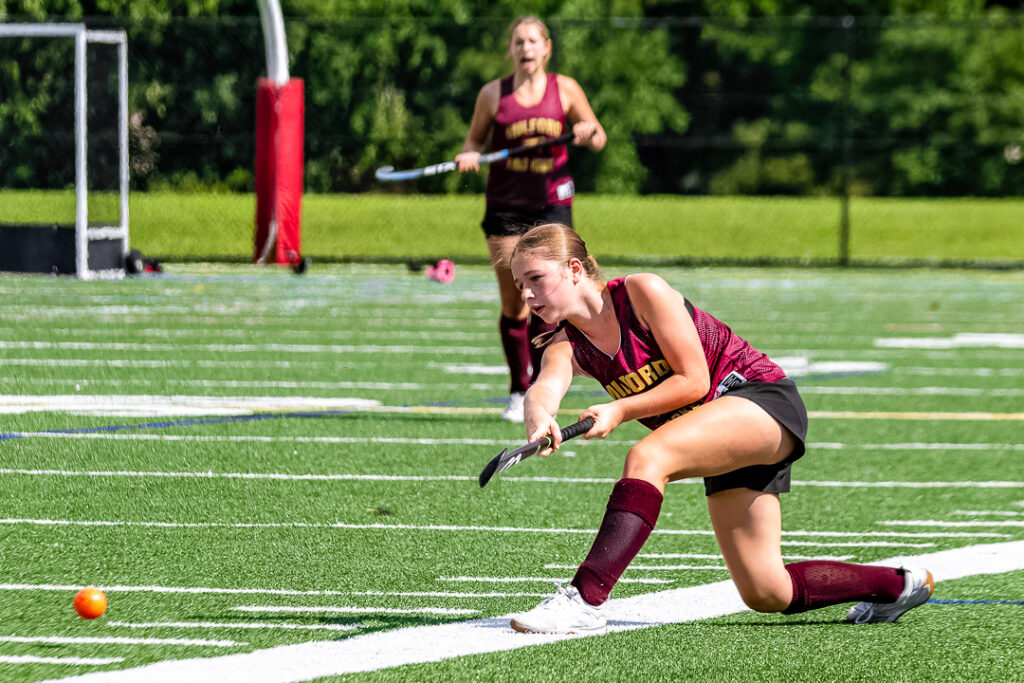 A Milford player sends the ball downfield giving her offense a chance to score. 
