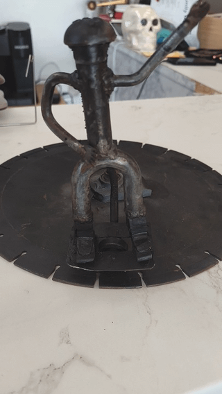 Handcrafted repurposed metal one wheel art. What do you guys think of it?