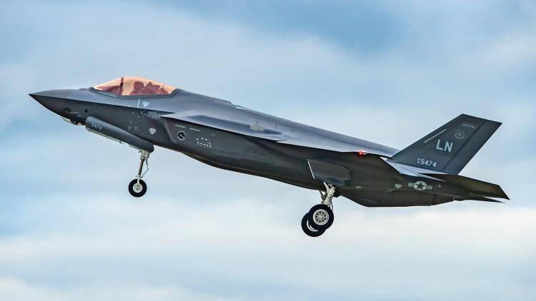 A US Air Force F-35A with landing gear down in flight.