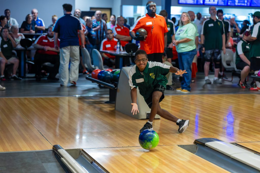 A Newark Dragons athlete shows off a perfect form while bowling at Special Olympics Delaware 2026 State Bowling Tournament.
