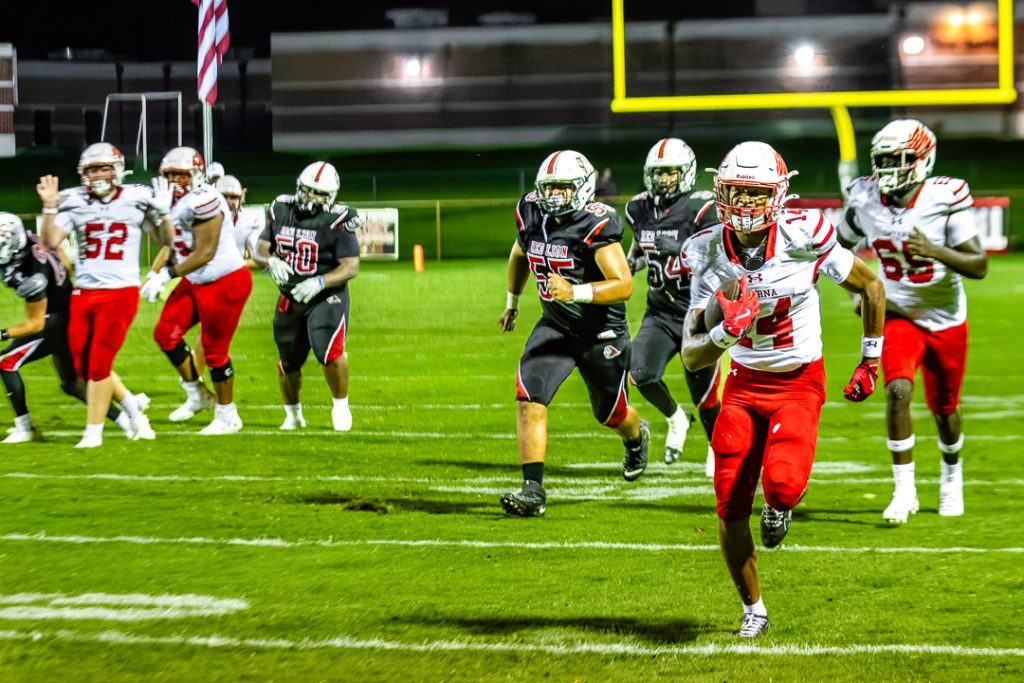 Junior receiver Mikiah Jackson runs down the left sideline to score his first touchdown of the game. Photo Credit: Dave Reeder