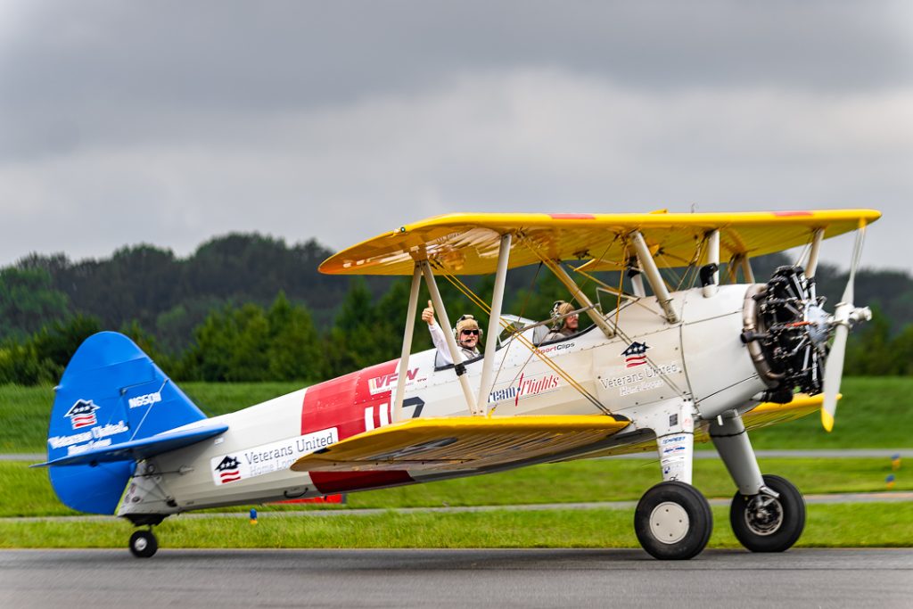 Fisher gives a thumbs up to the crowd after a successful landing. 