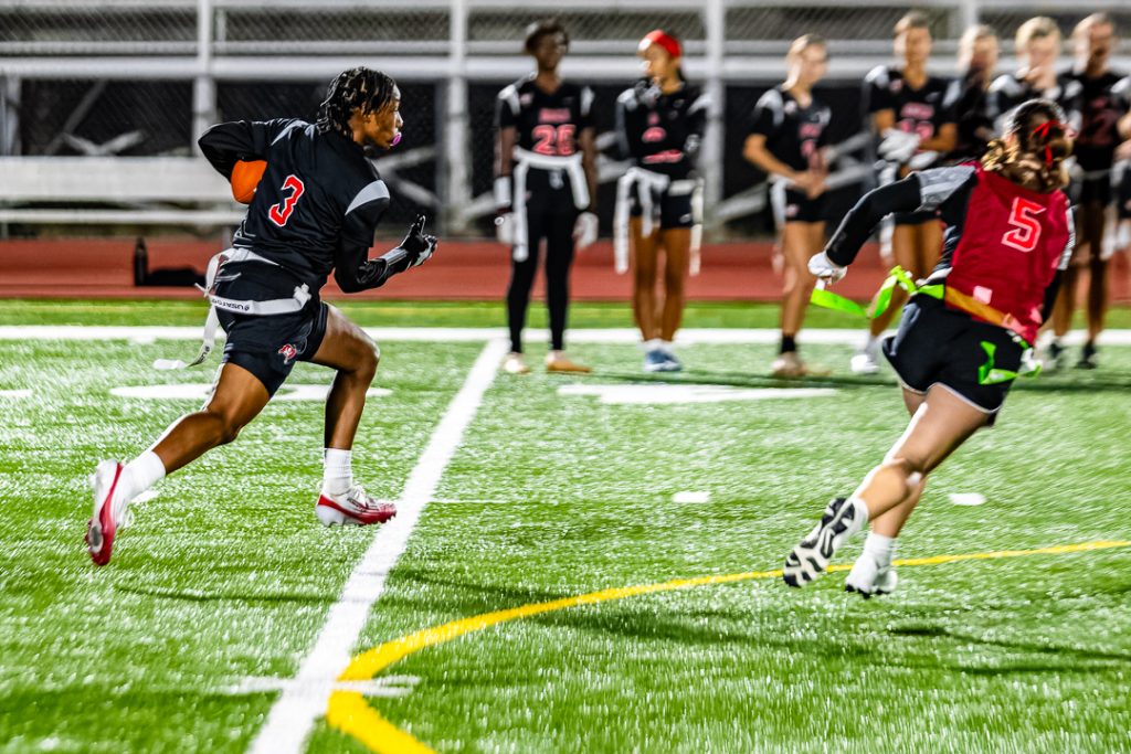 Sudler rushes downfield after receiving the handoff.