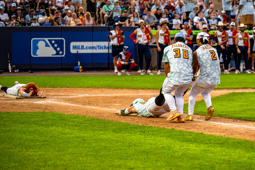 Coconut players Grady Morgan (No. 31) and Dane Tofteland (No. 23) recreate the scene from "Titanic" after Tofteland as hit by a pitch.