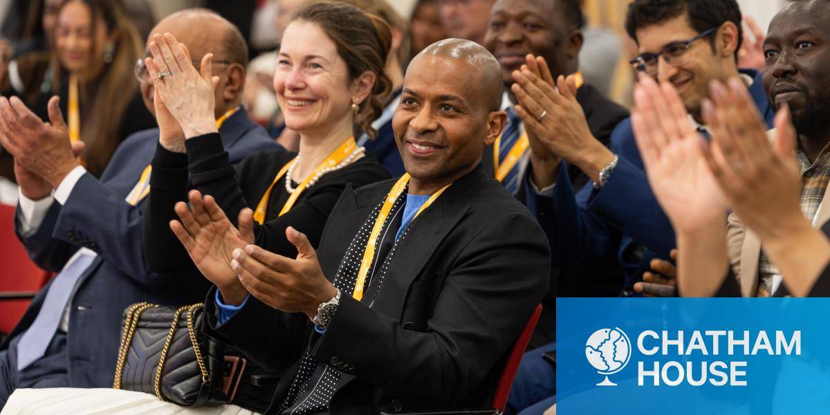 Group of people applauding at a Chatham House event