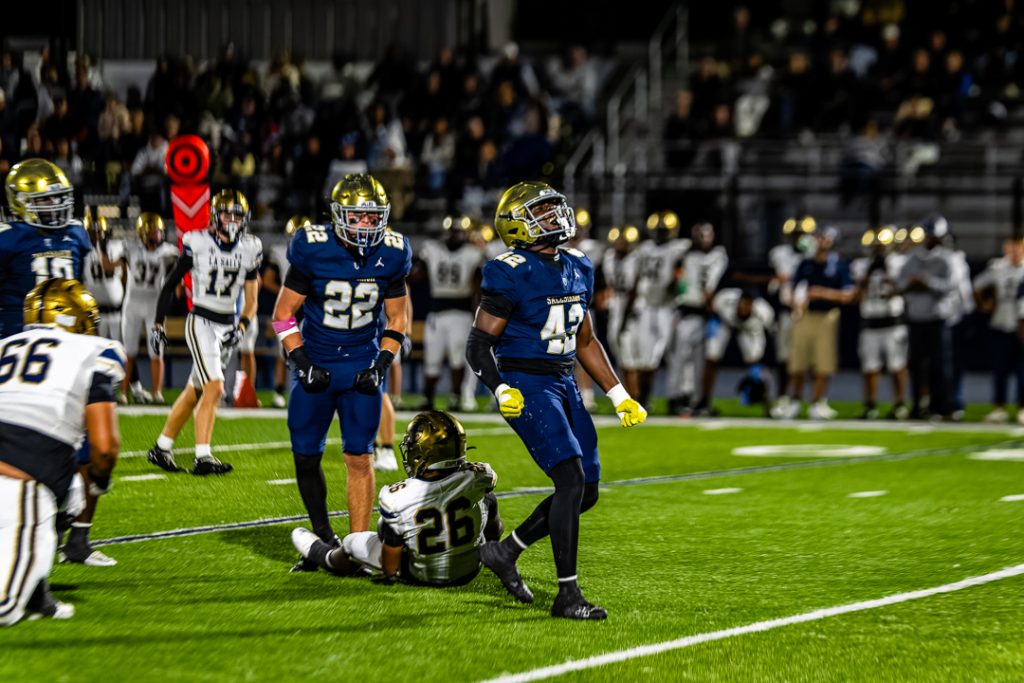Sophomore Tyler Clarke celebrates after registering a tackle for loss on the previous play.