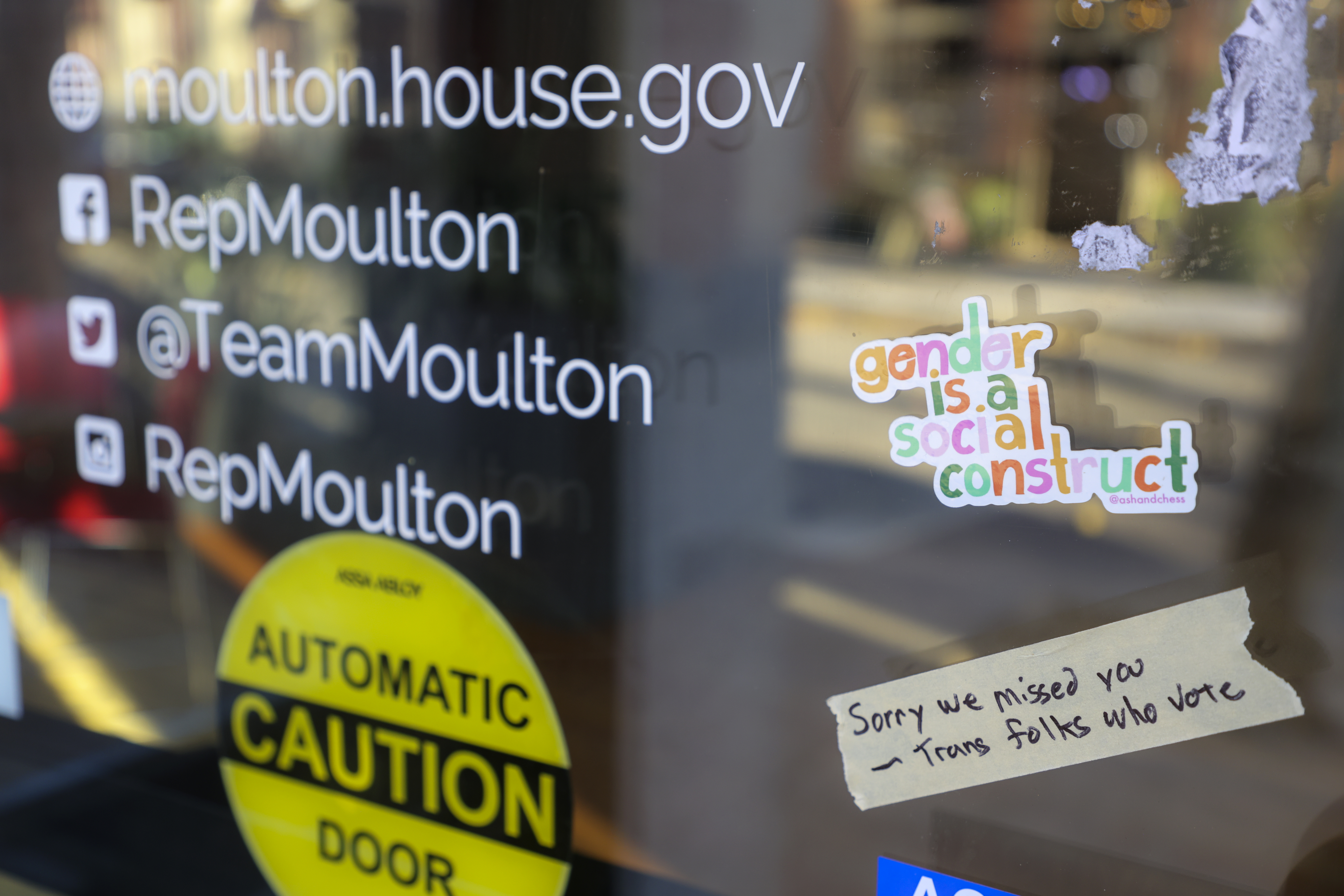 Salem, MA - November 8: Protesters placed stickers on the front door of Seth Moulton's office. (Photo by Matthew J. Lee/The Boston Globe via Getty Images)