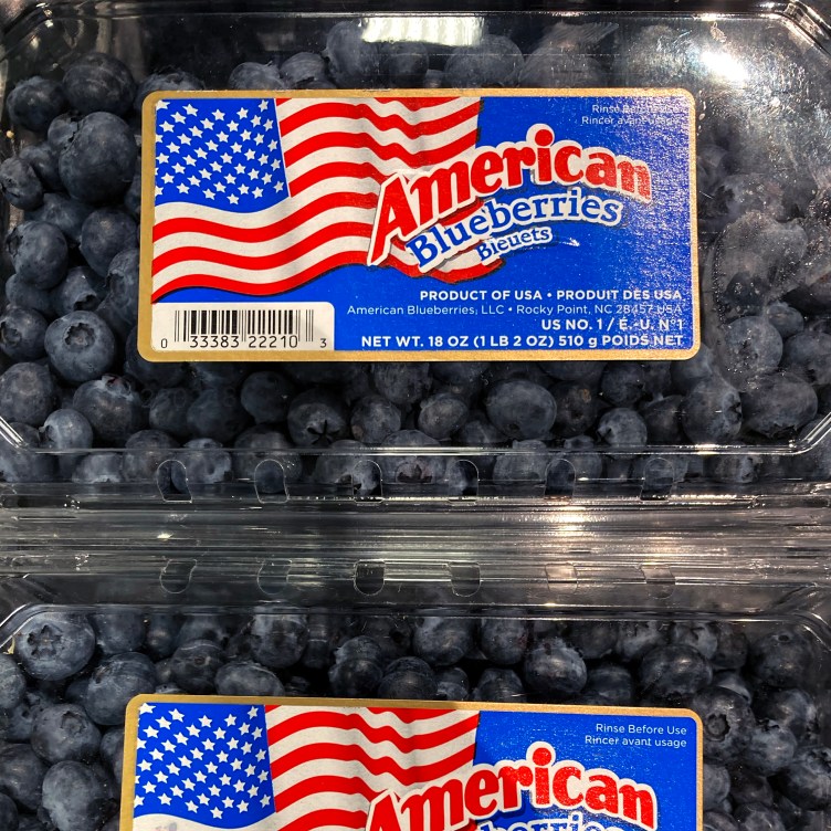 A grid of six blueberry packages with different labels.