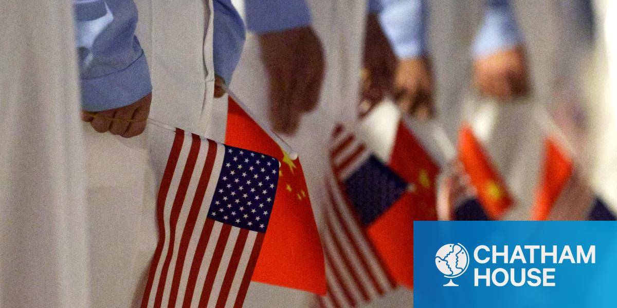 Chinese youth hold American and Chinese flags as they join officials to welcome US President Donald Trump at Beijing Capital International Airport. 