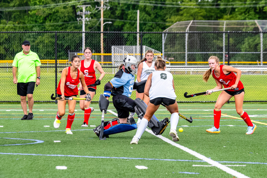The Smyrna Eagles' defense attempts to stop a Mighty Lions goal. 