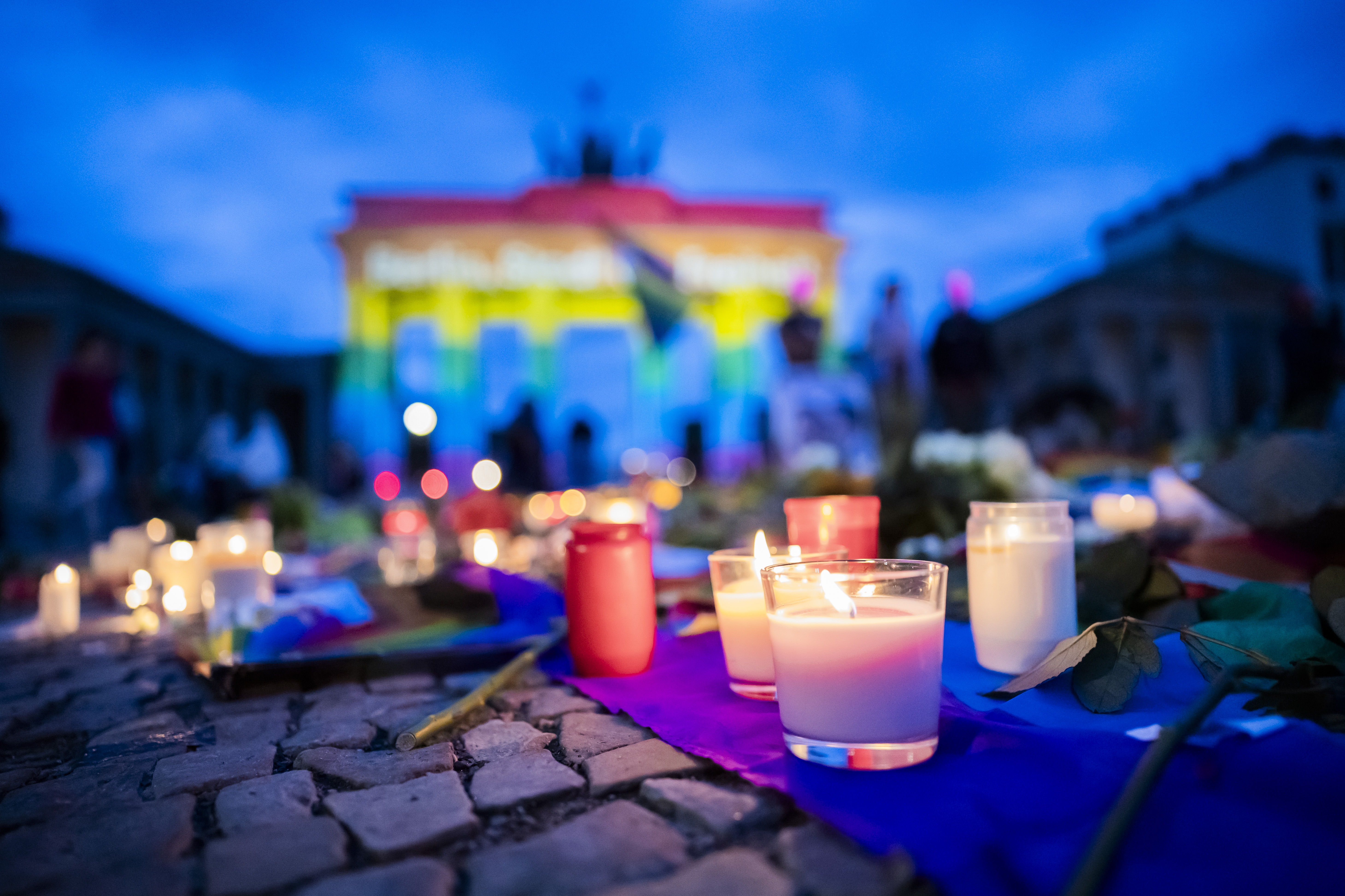 26 July 2026, Berlin: The Brandenburg Gate is illuminated in rainbow colors, displaying the words "Berlin, City of Freedom." Christopher Street Day in Berlin had been cut short the day before after a car plowed into a crowd on the outskirts of the large-scale event. At least one woman was killed, and many others were injuredseveral of them critically. Photo: Christoph Soeder/dpa (Photo by Christoph Soeder/picture alliance via Getty Images)