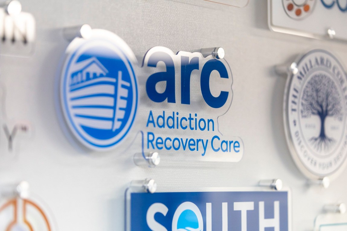 A photograph of numerous company logos. The center one reads, “ARC Addiction Recovery Care.”