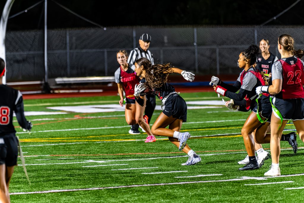 Buccanner junior Milania Sutor gets her flag pulled after intercepting an Ursuline pass.