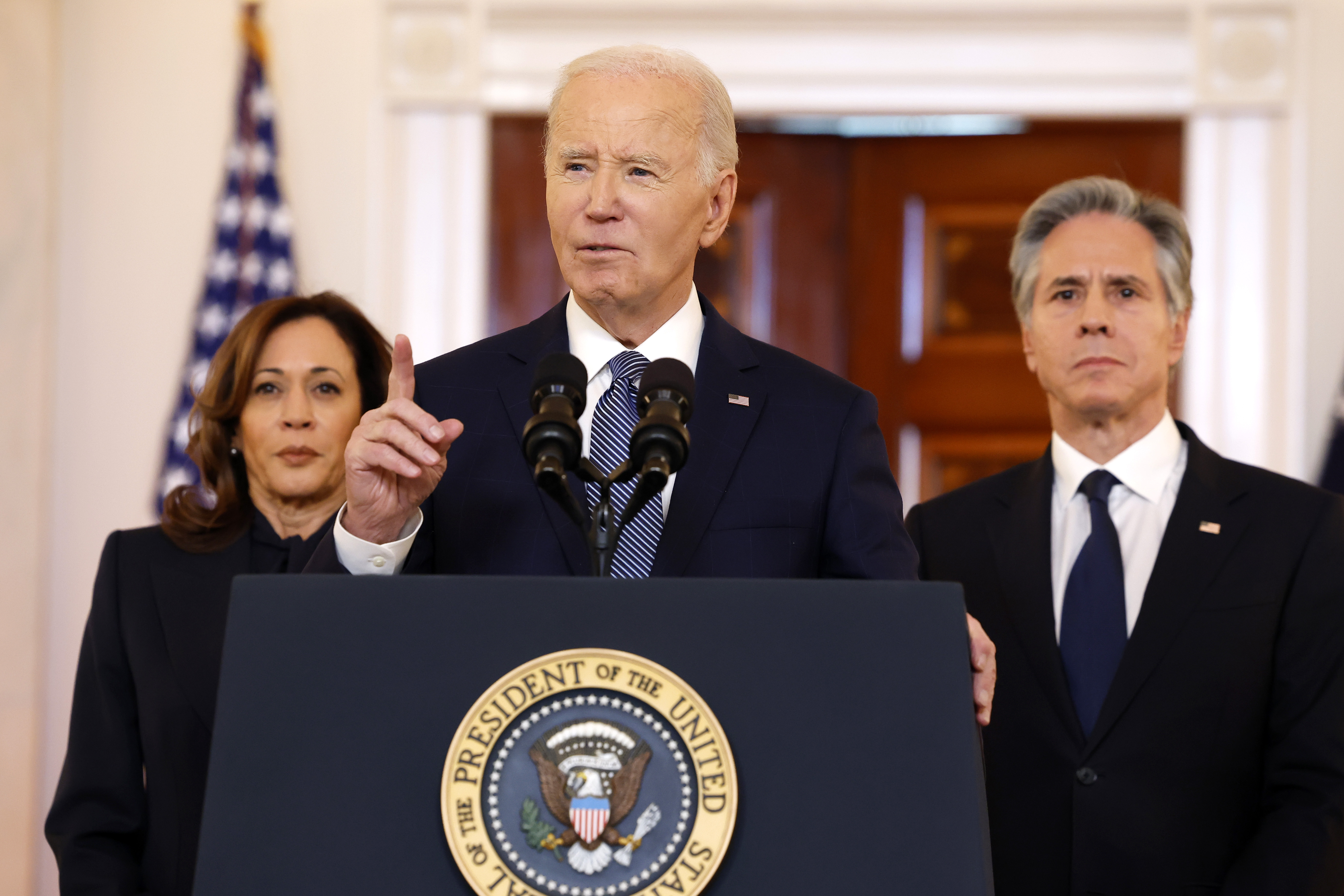 WASHINGTON, DC - JANUARY 15: U.S. President Joe Biden (C) delivers remarks on the recently announced cease-fire deal between Israel and Hamas while joined by Vice President Kamala Harris (L) and Secretary of State Antony Blinken in the Cross Hall of the White House on January 15, 2025 in Washington, DC. The multiphase cease-fire deal, brokered by the United States, Qatar and Egypt, commits Israel and Hamas to end the war in Gaza after 15 months.  (Photo by Anna Moneymaker/Getty Images)