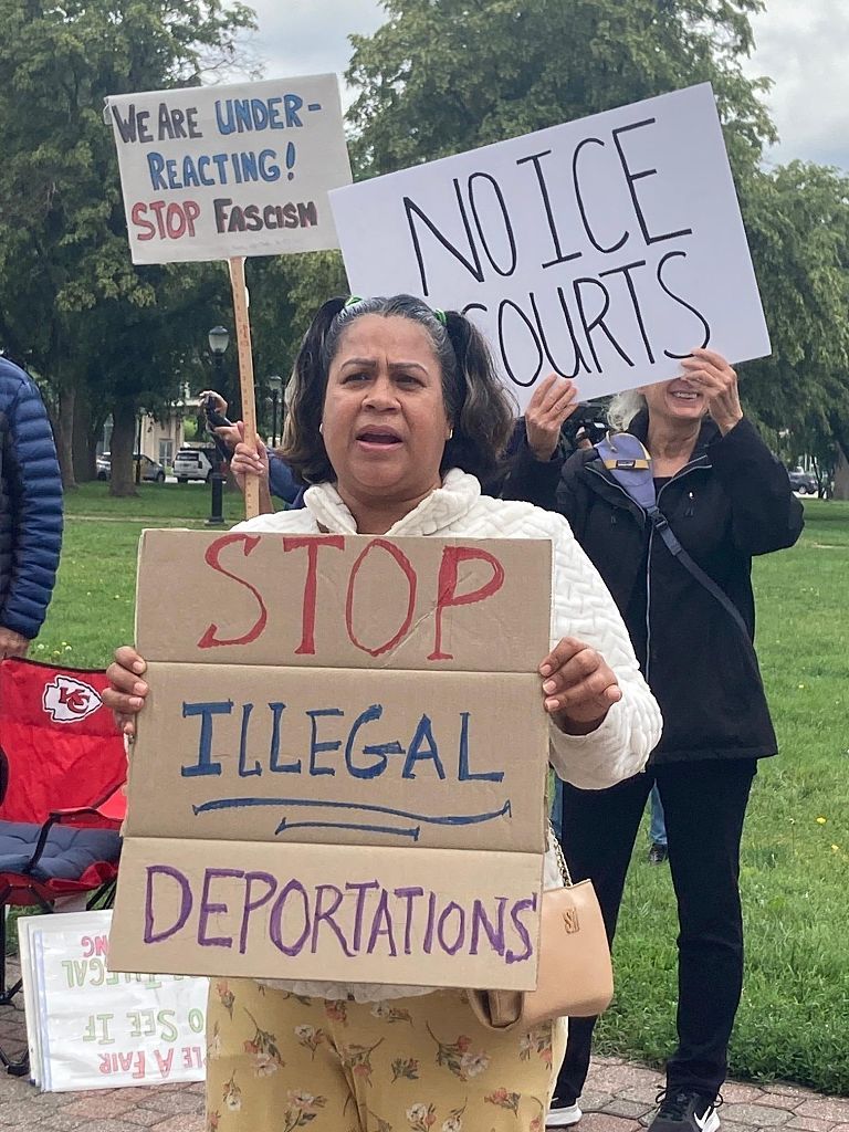 Aracely Mendoza protests outside federal Immigration Court in Kansas City on Tuesday, May 27. (Eric Adler/The Kansas City Star/Tribune News Service via Getty Images)