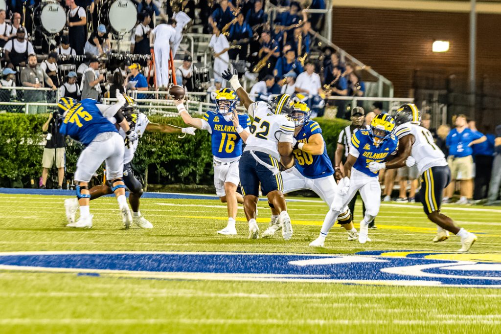 Blue Hen quarterback Braden Streeter throws a pass against Merrimack in the University of Delaware Fightin' Blue Hens first game of the season. Photo Credit: Dave Reeder.