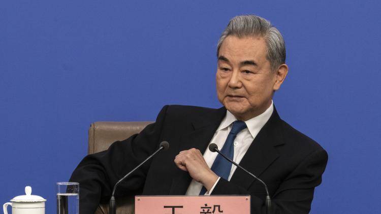 Chinese Foreign Minister Wang Yi listens to a question at a press conference at the National People's Congress on 8 March 2026 in Beijing, China.