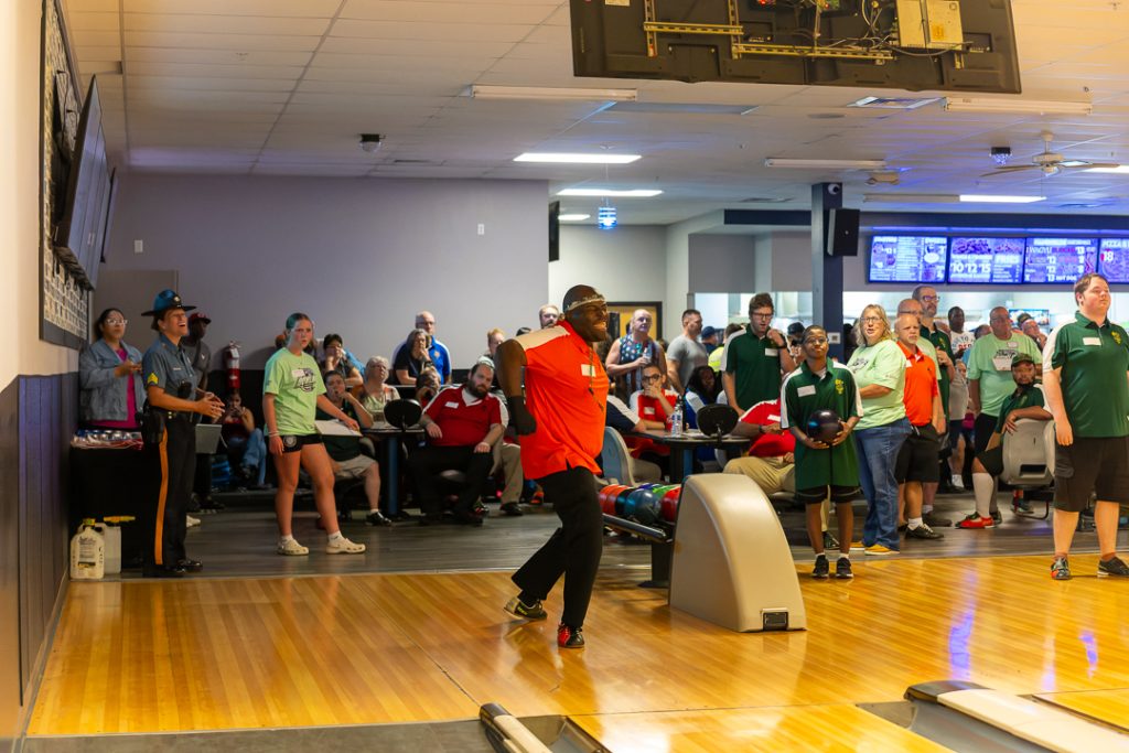 The Wizards' athlete celebrates scoring a strike.