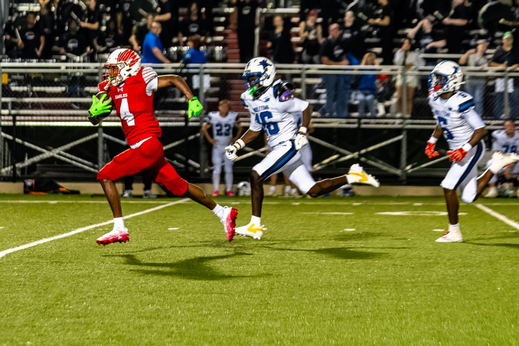 Smyrna junior, Hameed Lonon-Chase, runs downfield after a catch. Lonon-Chase scored Smyrna's first two touchdowns.