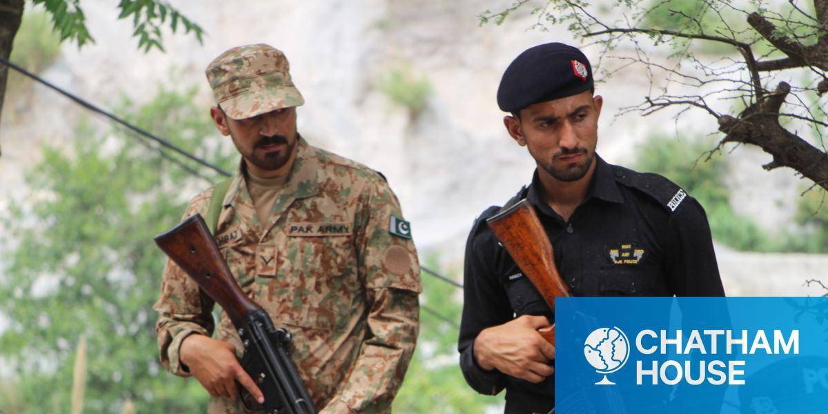 Two Pakistani soldiers are pictured holding rifles in Kashmir, May 2025.