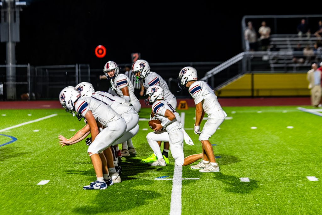 Patriot quarterback, Chase Kennedy, takes a knee securing Newark Charter's first win against Odessa in program history.