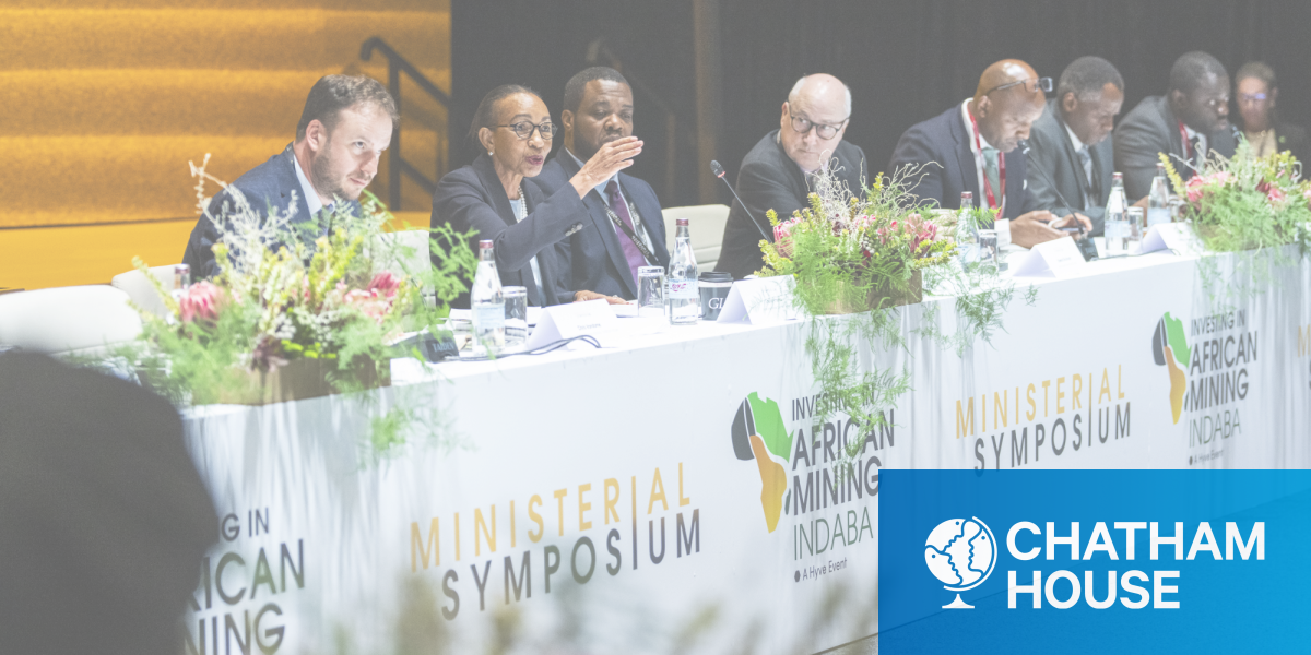 Chris Vandome (seated far left) with speakers at the ministerial symposium.