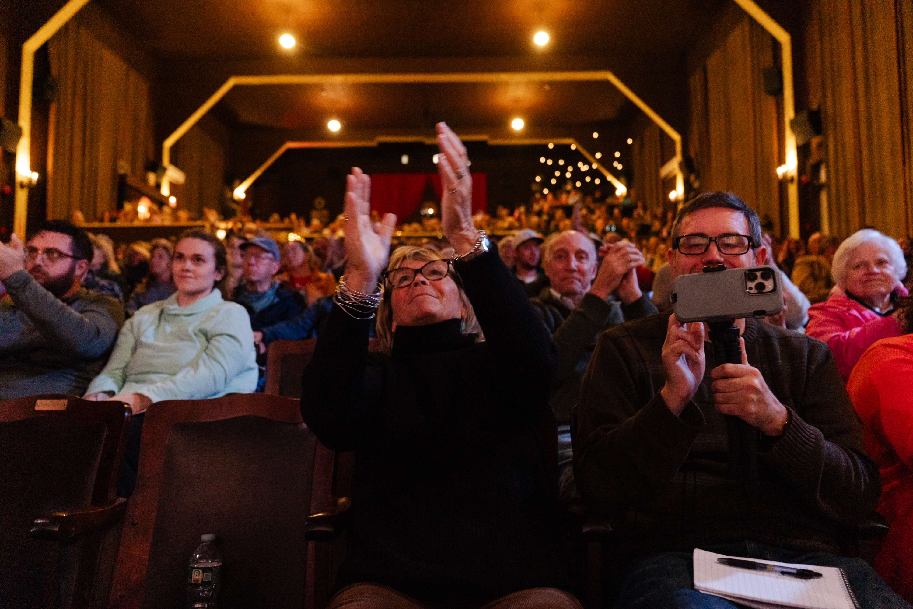 OGUNQUIT, MAINE - OCTOBER 22: Leslie Harlow, the mother of U.S. senatorial candidate from Maine Graham Platner, applauds her son during a town hall at the Leavitt Theater on October 22, 2025 in Ogunquit, Maine. Platner, a veteran of the U.S. Marines and an oyster farmer, is running for the seat held by Sen. Susan Collins (R-ME). (Photo by Sophie Park/Getty Images)