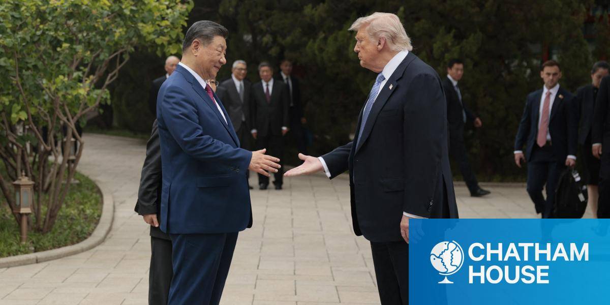 Donald Trump and Xi Jinping shake hands.