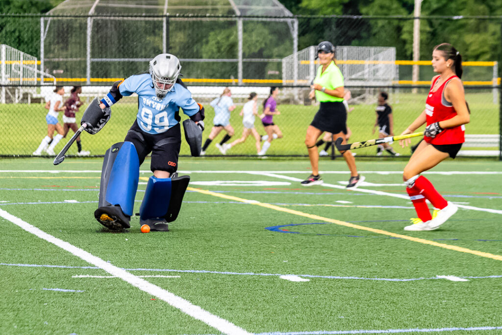 The Smyrna goalie concentrates on making a save in their scrimmage against Easton High School.