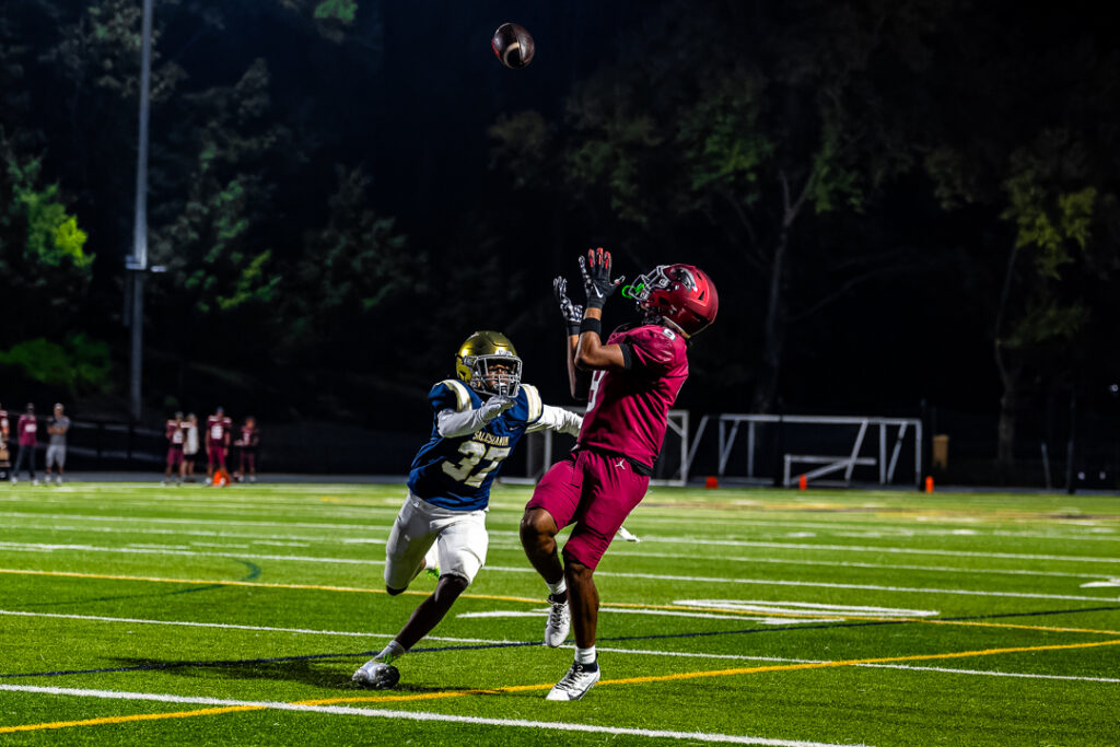 A St. Joseph wide receiver tracks the throw from his quarterback as he nears the endzone.