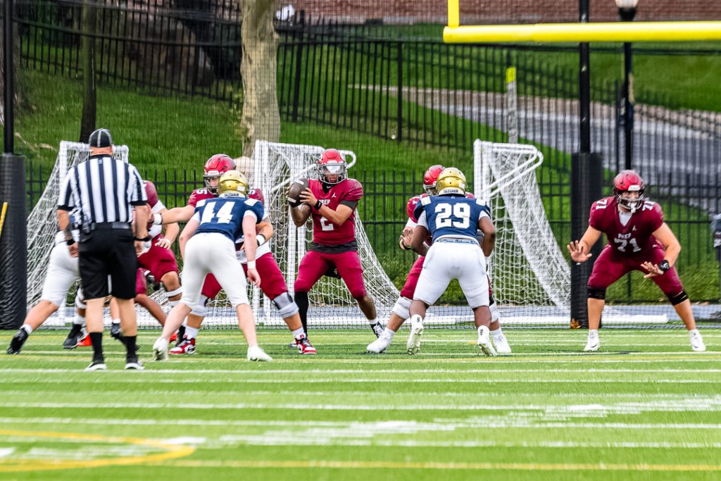 St. Joseph's quarterback surveys the Salesianum defense as he receives the snap. 