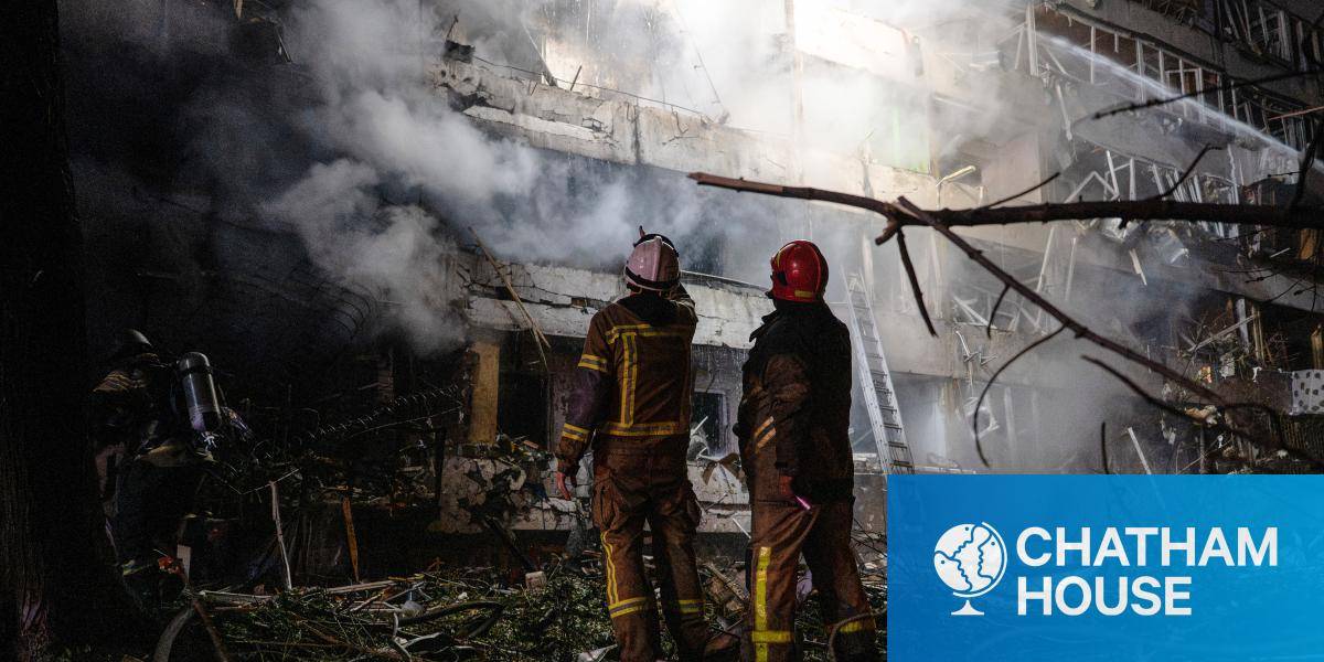 Ukrainian firefighters extinguish a blaze at the site of a Russian missile strike in Kyiv on 14 October 2026. 