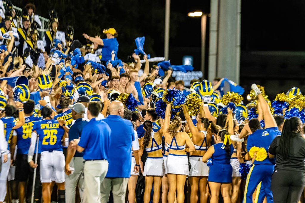 The Blue Hen players celebrate with the fans in the stands after their win over the Merrimack Warriors. Photo Credit: Dave Reeder.