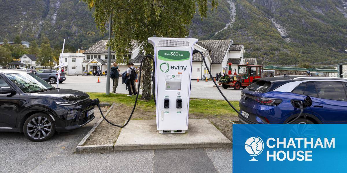 Two electric vehicles plugged into a recharging station in the Norwegian fjord village of Eidfjord. 