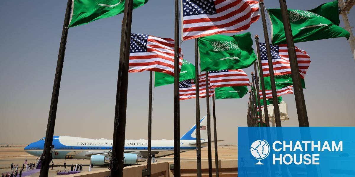 US and Saudi Arabian flags flutter in the foreground at King Khalid International Airport - with the Air Force One jet in the background