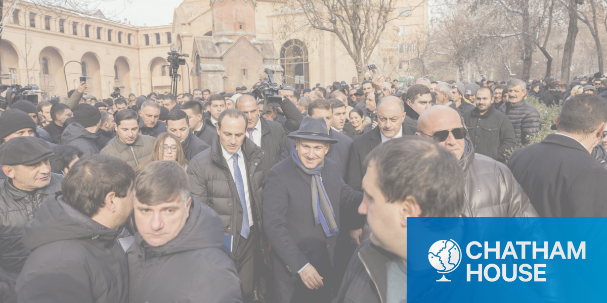 Prime Minister Nikol Pashinyan walks surrounded by supporters and security during a march in central Yerevan, Armenia on 6 January 2026. 