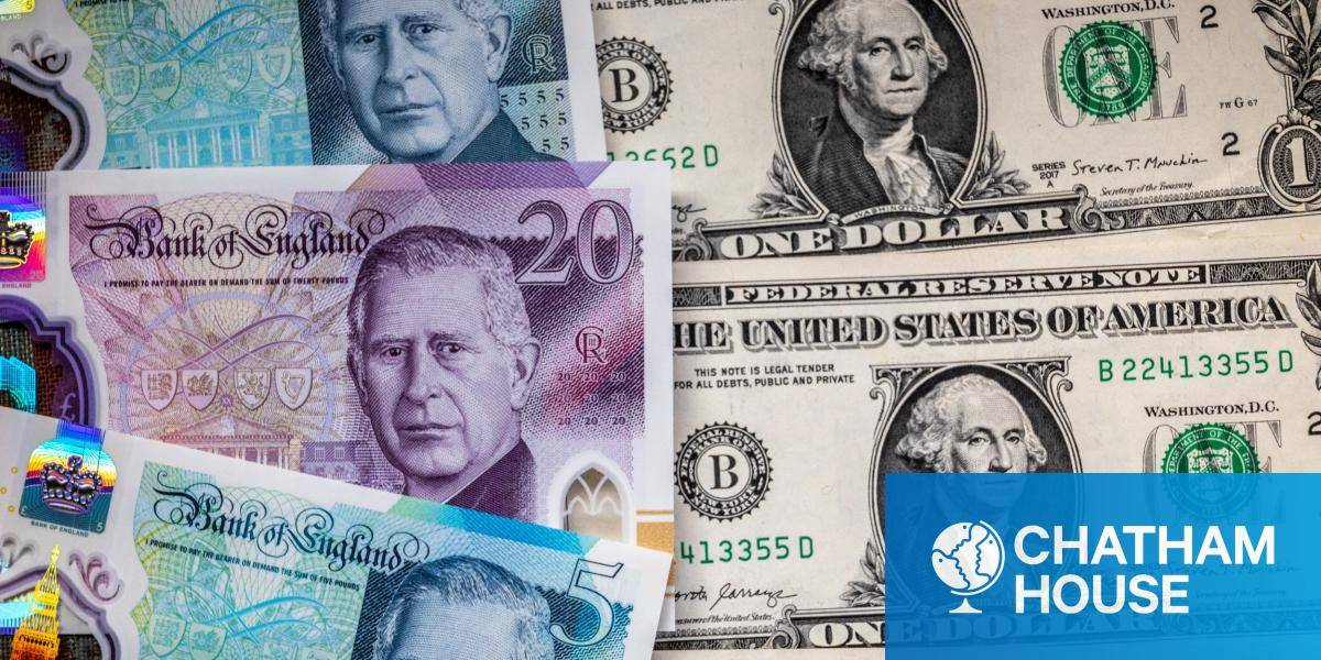 British pound notes arranged next to one dollar bills. 