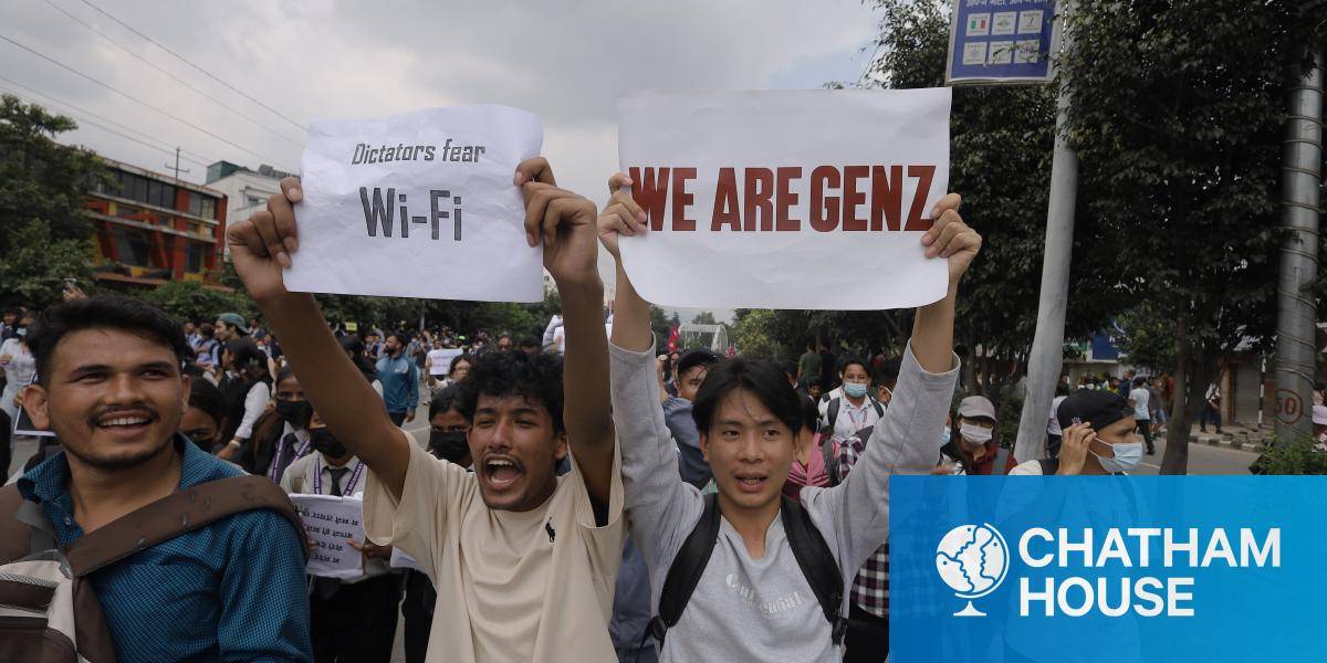 young people protesting holding signs