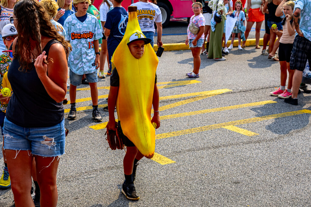 A young fan dressed as a Banana walks around the plaza pregame.