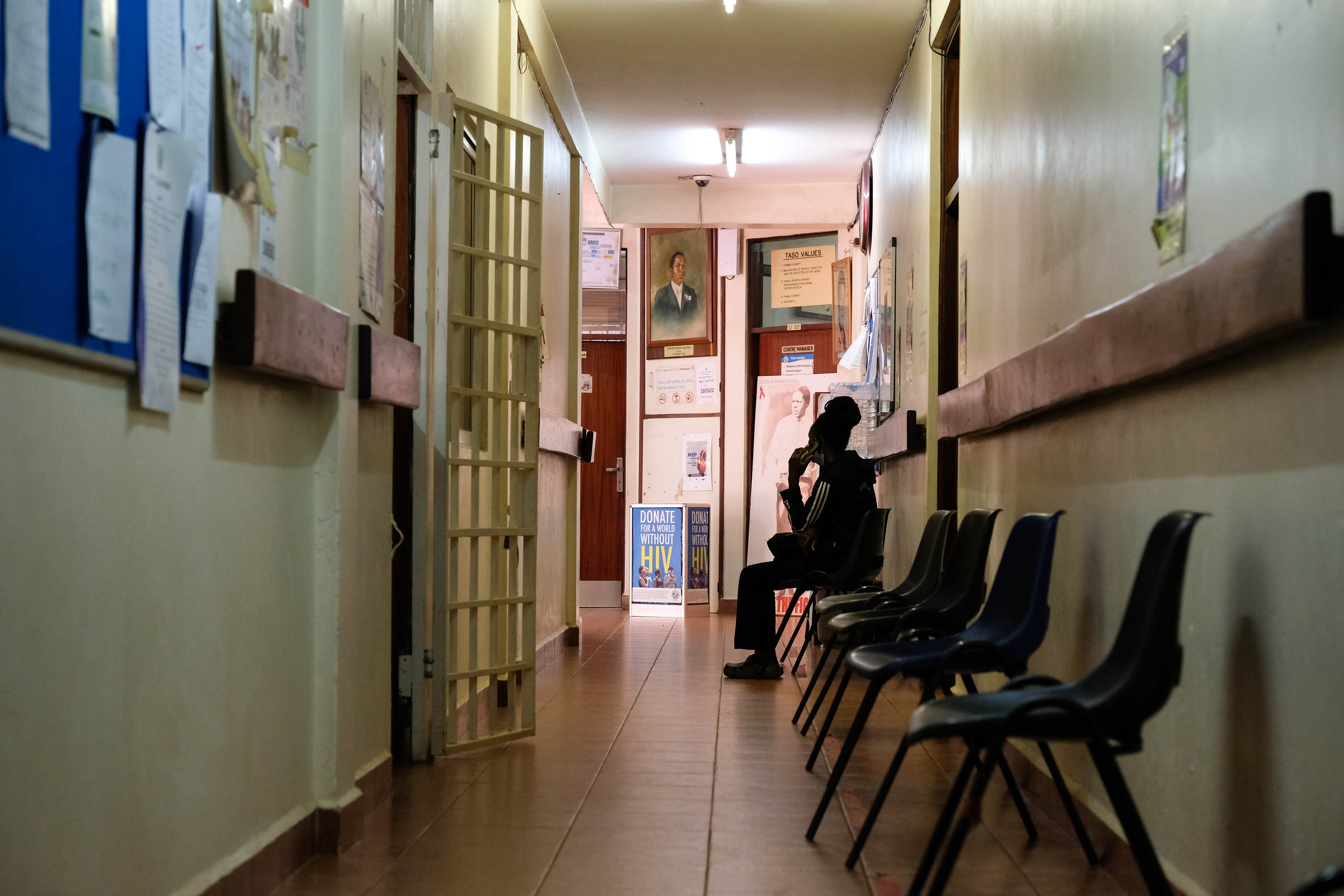 KAMPALA, UGANDA - FEBRUARY 17: A client waits to be seen by a doctor during an HIV clinic day at TASO Mulago service center on February 17, 2025 in Kampala, Uganda. The AIDS Support Organization (TASO) center at Mulago Hospital in Kampala provides a range of clinical and psychological support services to people living with HIV and AIDS in Kampala, with 50 per cent of TASO funding provided through The United States Agency for International Development (USAID). Following US President Donald Trump's executive order to freeze all USAID funding for 90 days, TASO's Executive Director Dr. Bernard Etukoit says that amongst their clients there is a lot of panic, fear, and anxiety, about how the cuts could impact their access to treatment and services. An emergency waiver issued by the US Department of State has allowed life-saving humanitarian assistance programs to continue during the freeze, including the antiretroviral therapy (ART) TASO offers, but uncertainty remains for those whose lives and livelihoods remain dependent on the flow of USAID funding. (Photo by Hajarah Nalwadda/Getty Images)