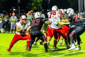 Smyrna senior William Ngayi-Parker (No. 42) makes a block during Smyrna's win over Red Lion on September 4. Photo Credit: Dave Reeder