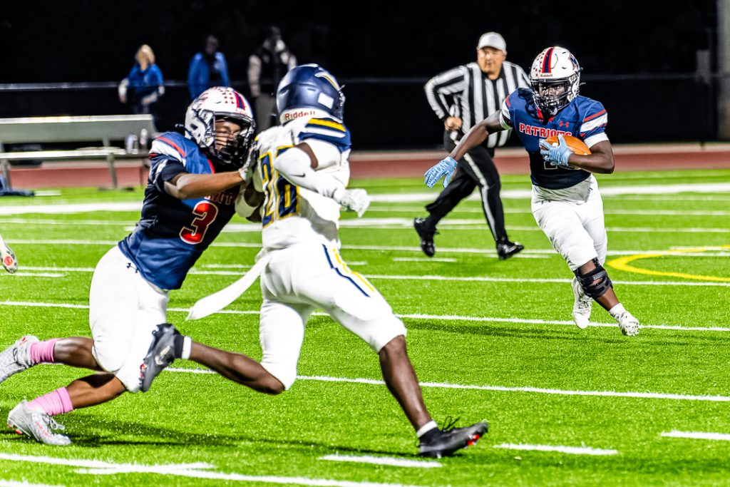 Patriot senior Austin Gbadegbe looks on as his blocks get set. 