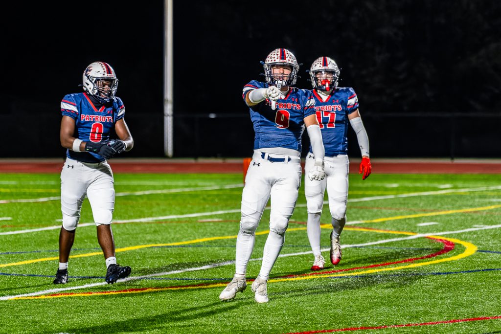 Patriot senior Alexander Burrows celebrates after recording a sack.