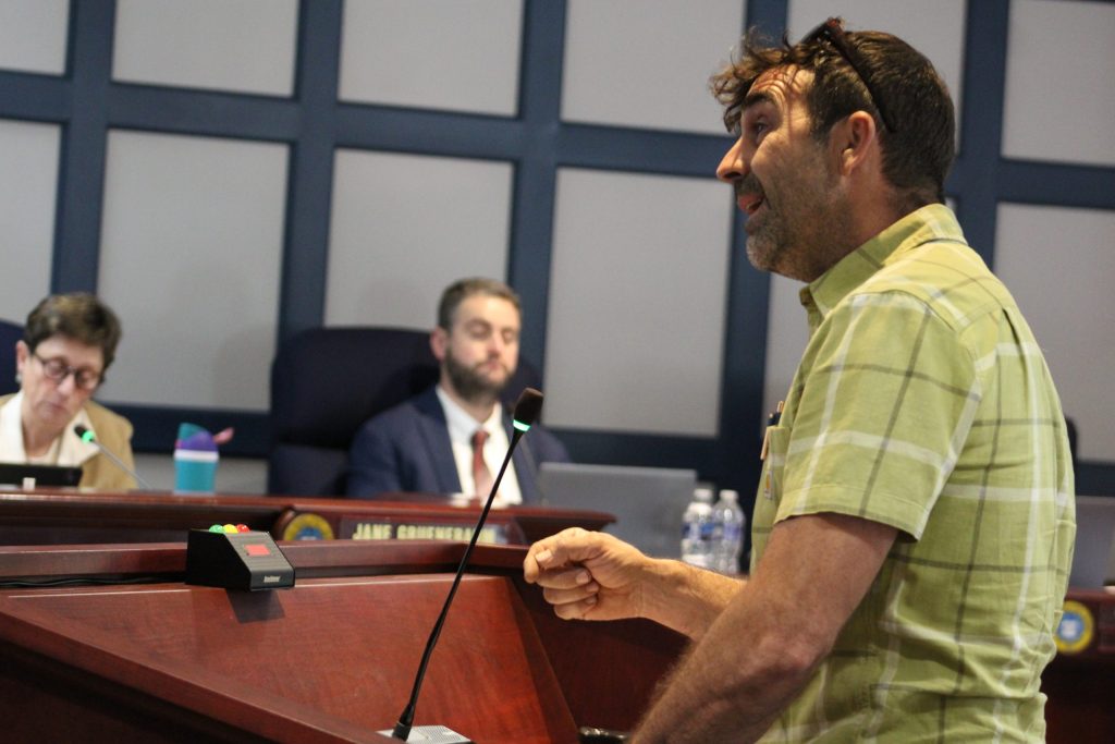 Georgetown farmer Jay Baxter speaks in front of the Sussex County Council in May.